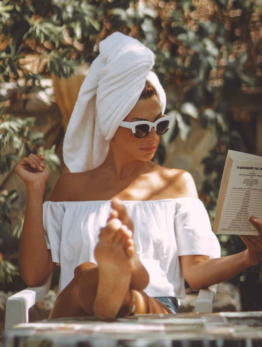 photo of woman holding book